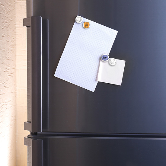Empty paper sheets on fridge door